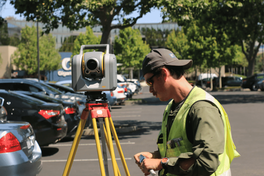 An image of a surveyor conducting a land survey. 
