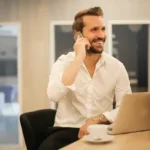 man smiling on the phone