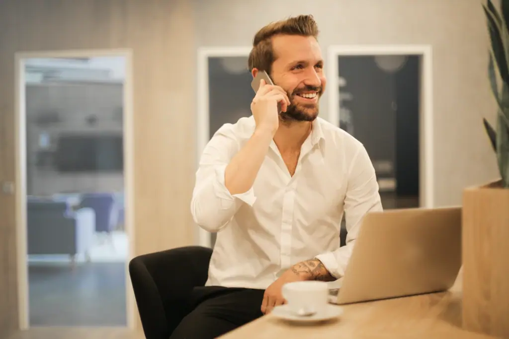 man smiling on the phone