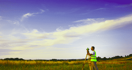 A technician conducting a land survey