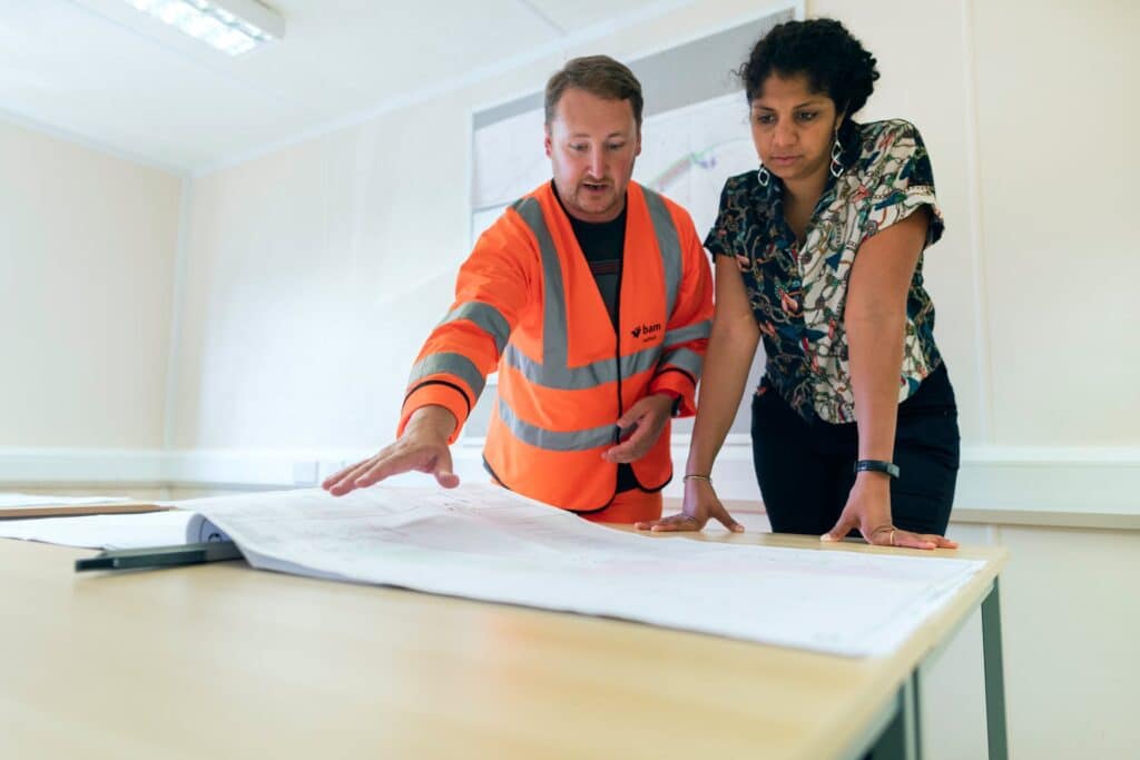people evaluating a property blueprint