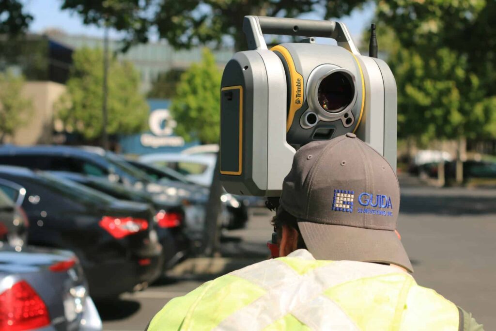 A surveyor conducting comprehensive services, symbolizing Millman National Land Services' expertise