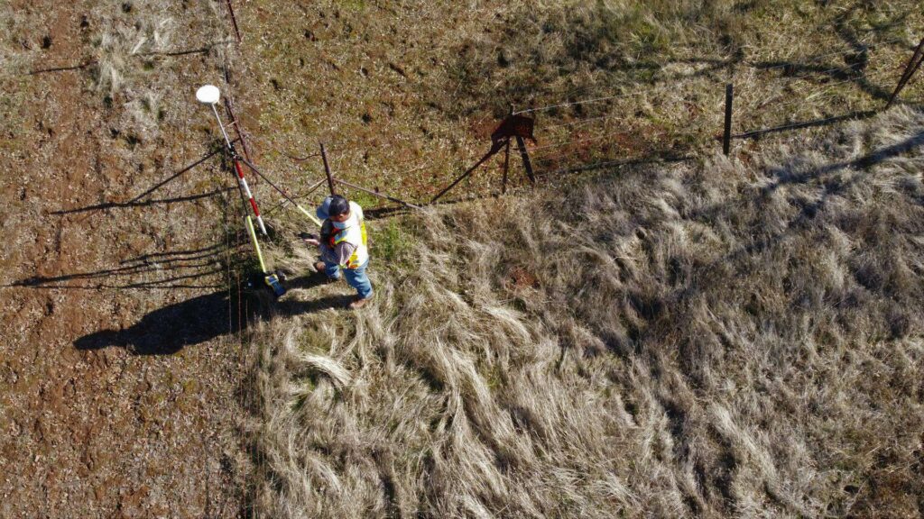 top view of man in surveying land with a satellite
