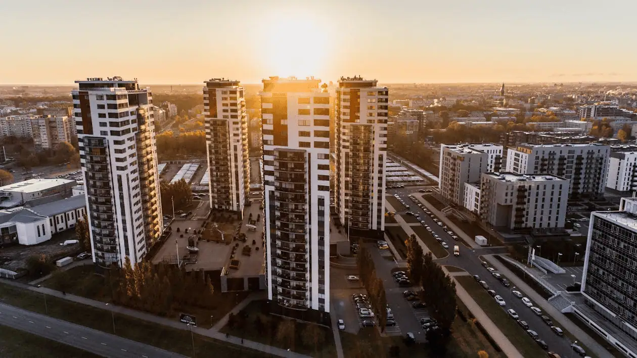 high angle photography of high rise buildings near road during golden hour
