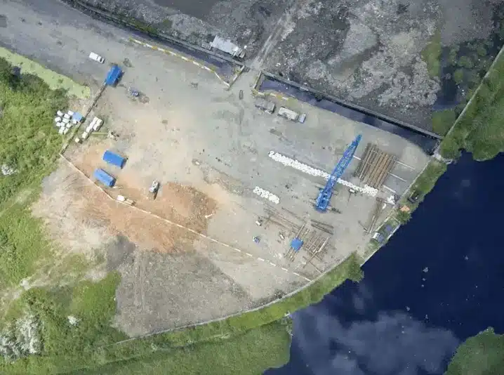 aerial drone view of commercial land surveyor conducting boundary survey in Oklahoma City