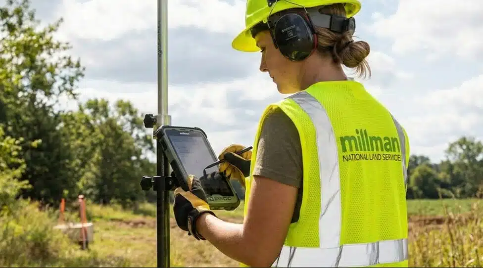 commercial land surveyor using GPS equipment to document property boundariest