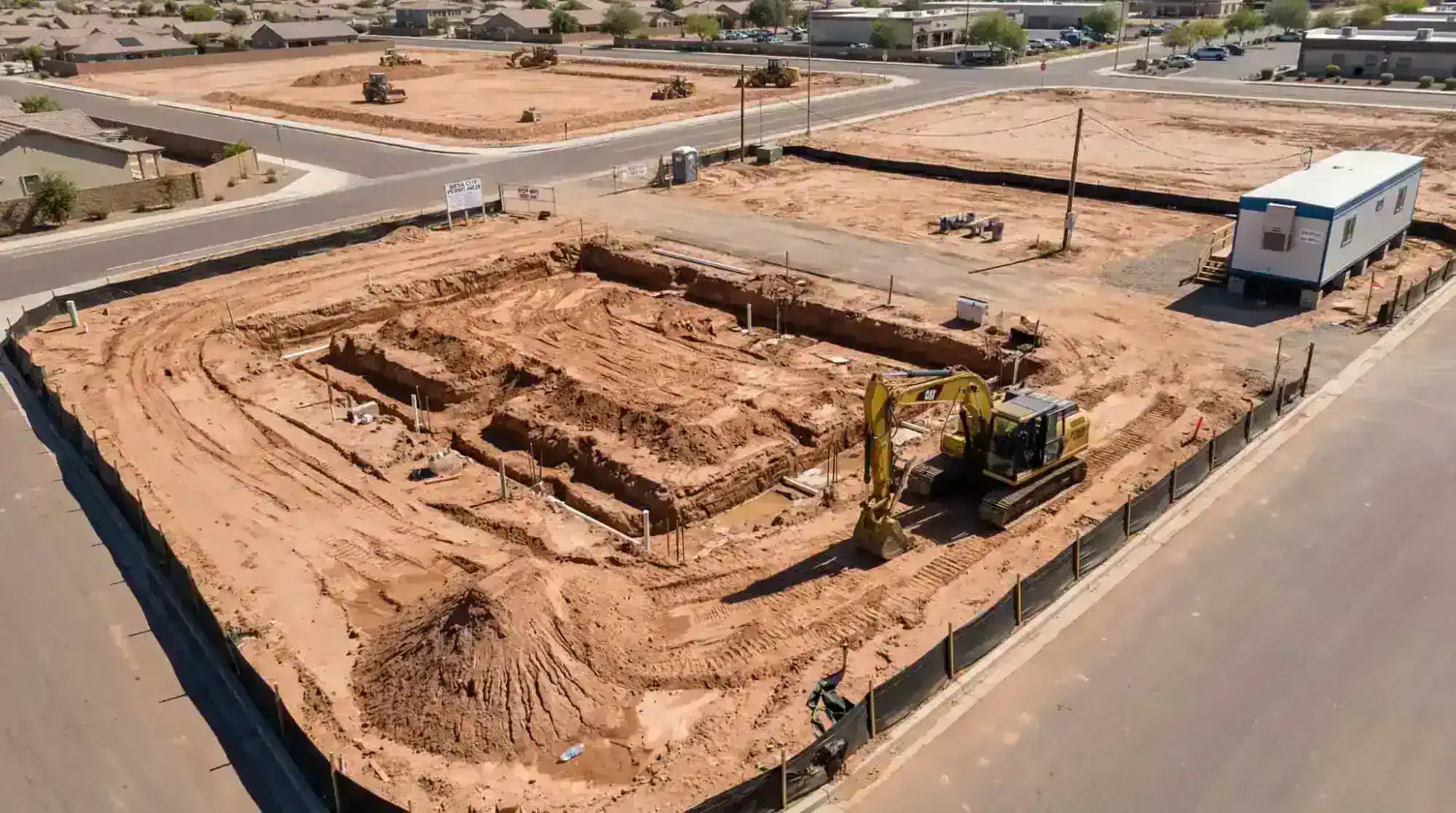 A clear aerial drone view of a commercial construction site in Mesa Arizona showing property boundaries.